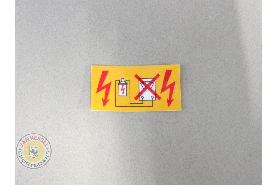 90160250200 - Sticker 'Vorsicht Zundanlage' gele rand, op bobine 911 65-89